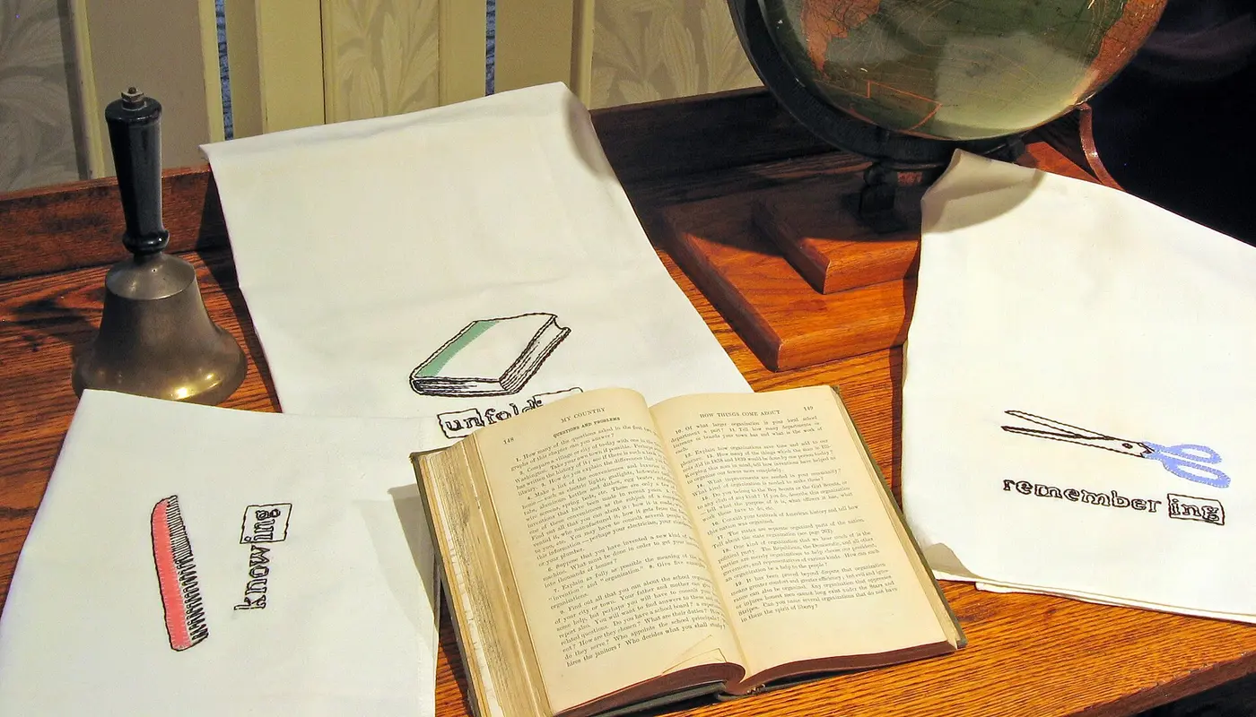 Globe and desk   needlework on display at Stevens County Museum